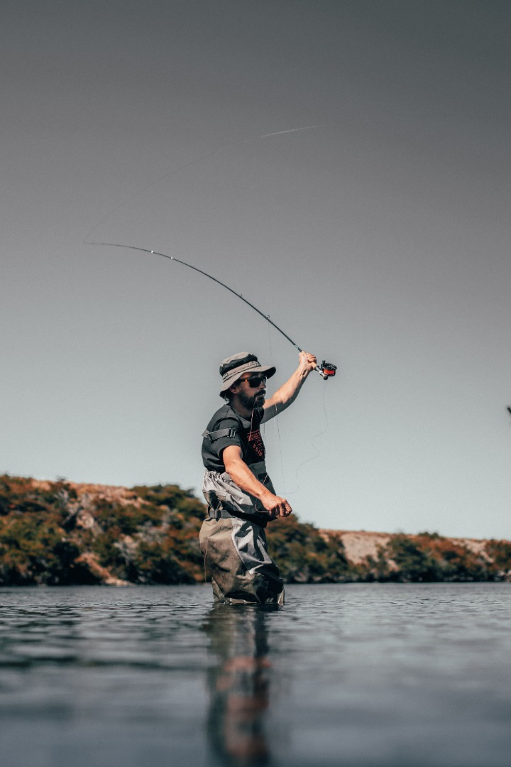 Wading fly fisherman
